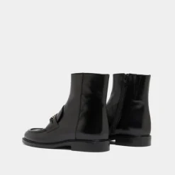 Boots à mors dorés