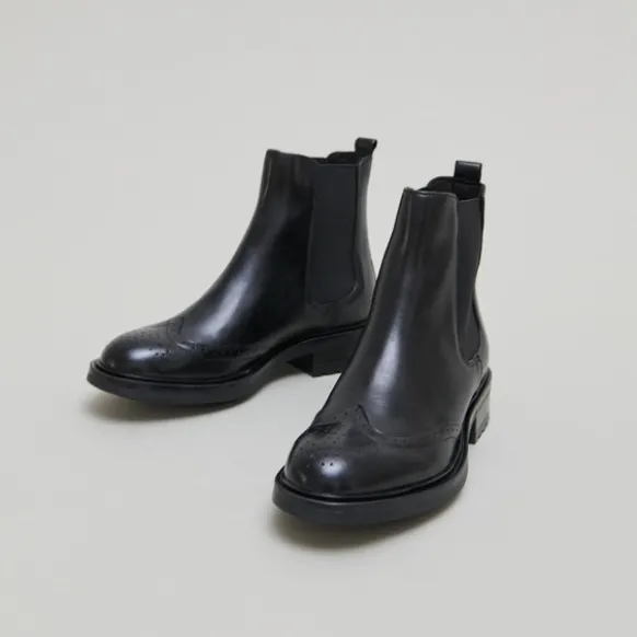 Boots basses à élastiques et détails ajourés