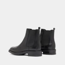Boots basses à élastiques et détails ajourés