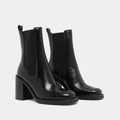 Bottines à talons débordants
