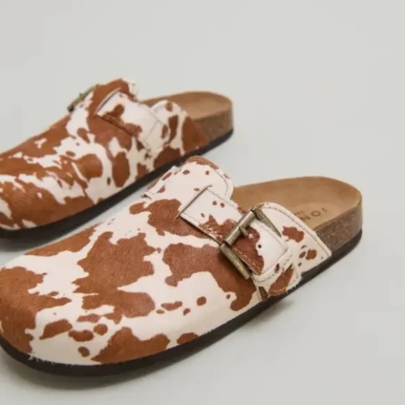 Mules à boucles
