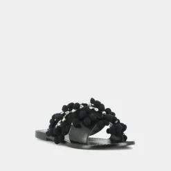 Mules à pompons et perles
