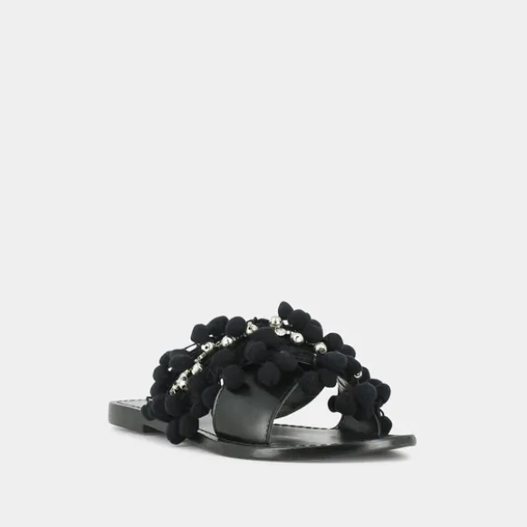 Mules à pompons et perles